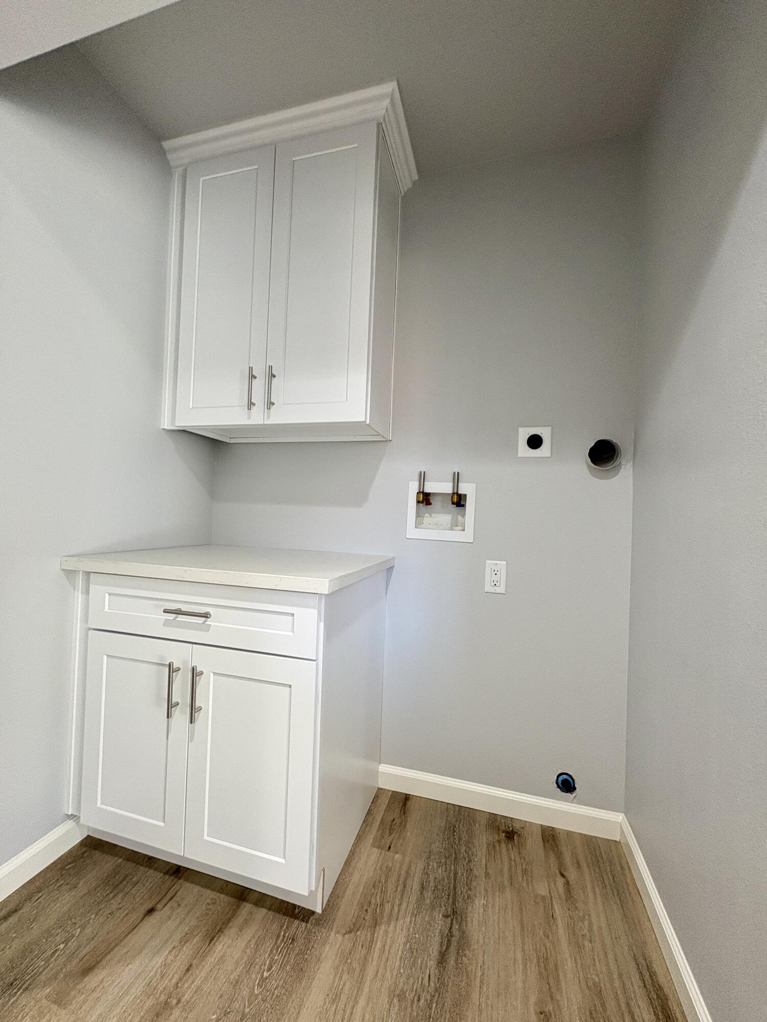 37132 Kendrick Circle, Unit B Palmdale, CA 93550 - Photo 4 of 10 a view of cabinets with wooden floor