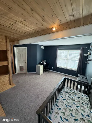 a view of a room with furniture and window