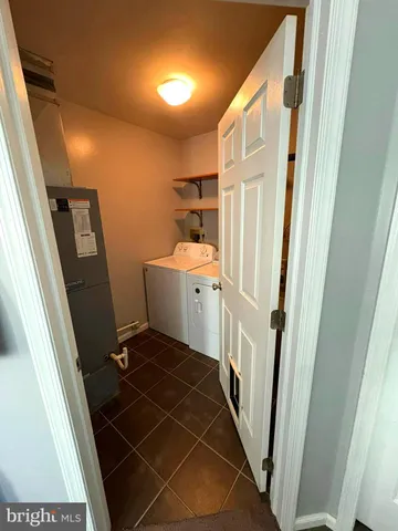 a bathroom with a sink a toilet a toilet a sink and a mirror