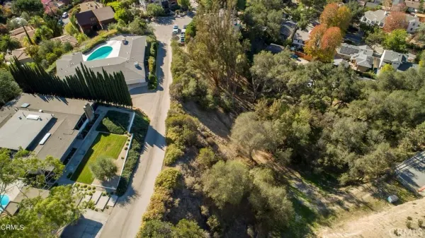 an aerial view of residential house and green space