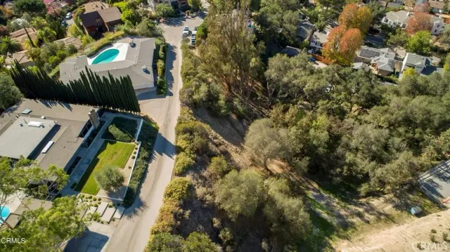 an aerial view of residential house and green space