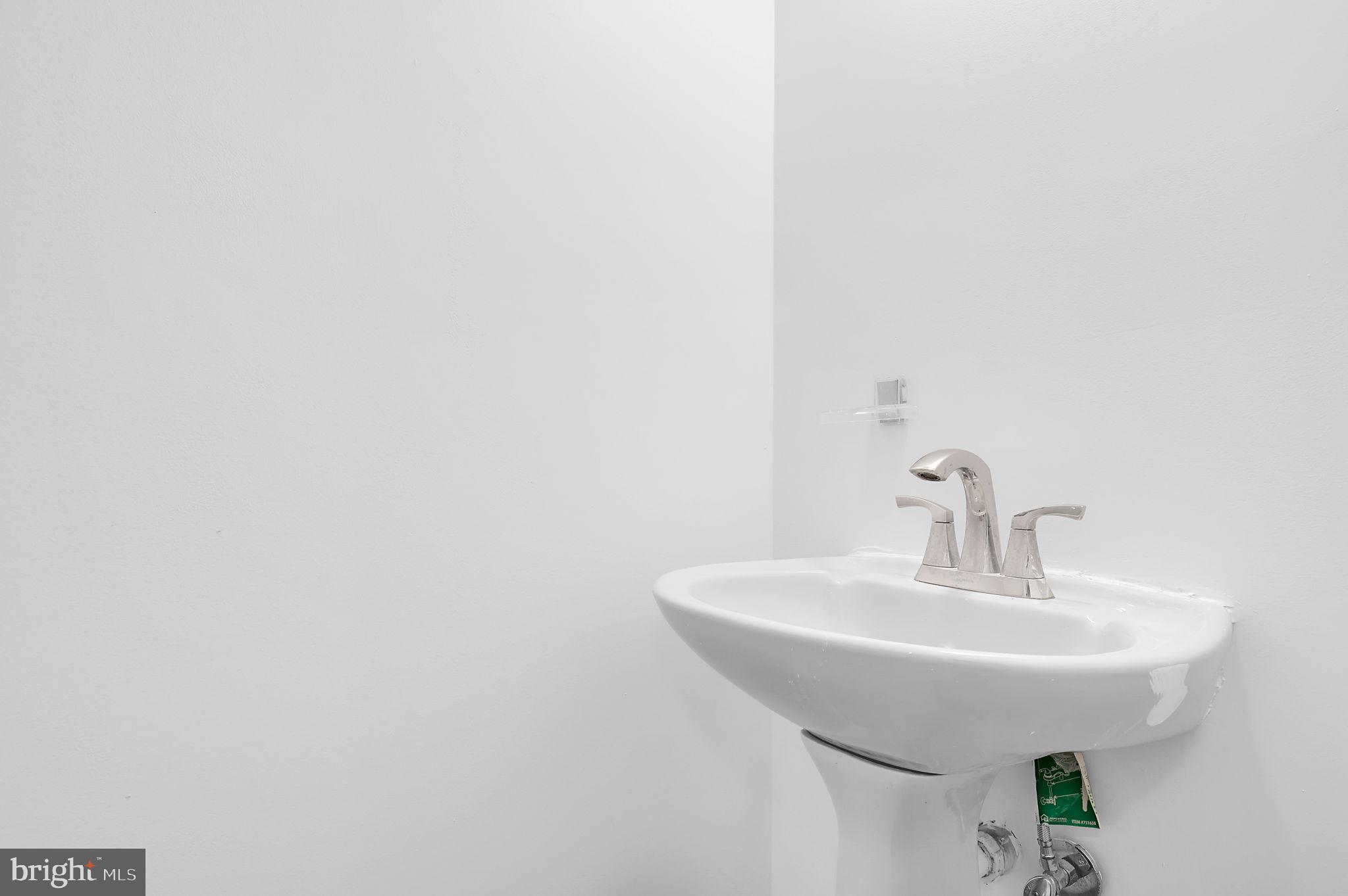 7922 Red Barn Way Elkridge, MD 21075 - Photo 12 of 31 a bathroom with a sink and mirror