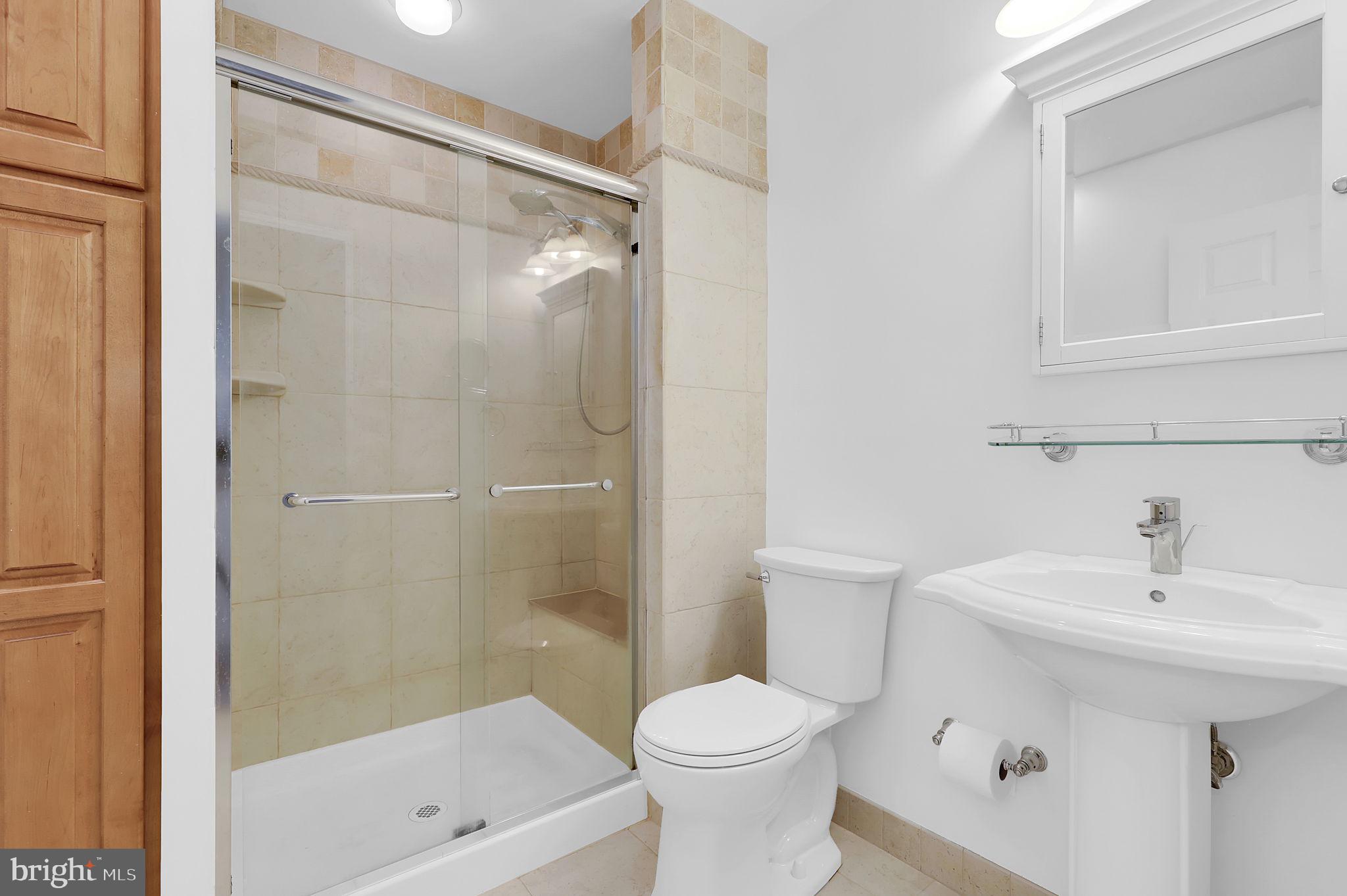 7922 Red Barn Way Elkridge, MD 21075 - Photo 19 of 31 a bathroom with a sink a toilet and shower