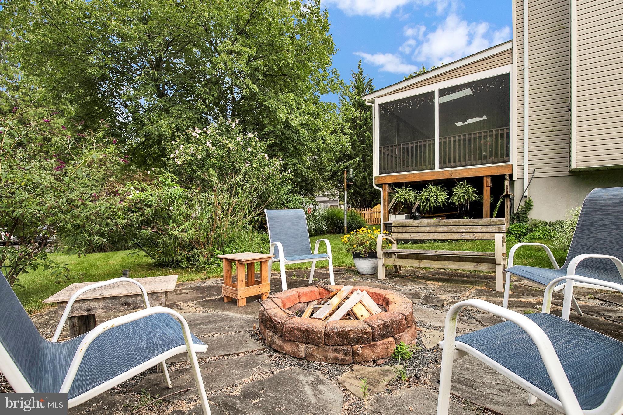 7922 Red Barn Way Elkridge, MD 21075 - Photo 25 of 31 a view of a patio with couches chairs and a potted plant