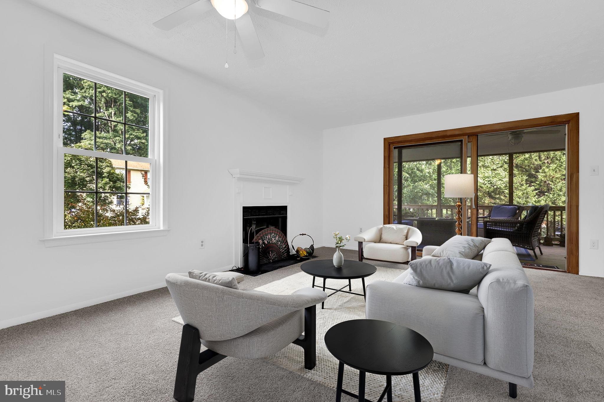 7922 Red Barn Way Elkridge, MD 21075 - Photo 6 of 31 a living room with furniture and a lamp
