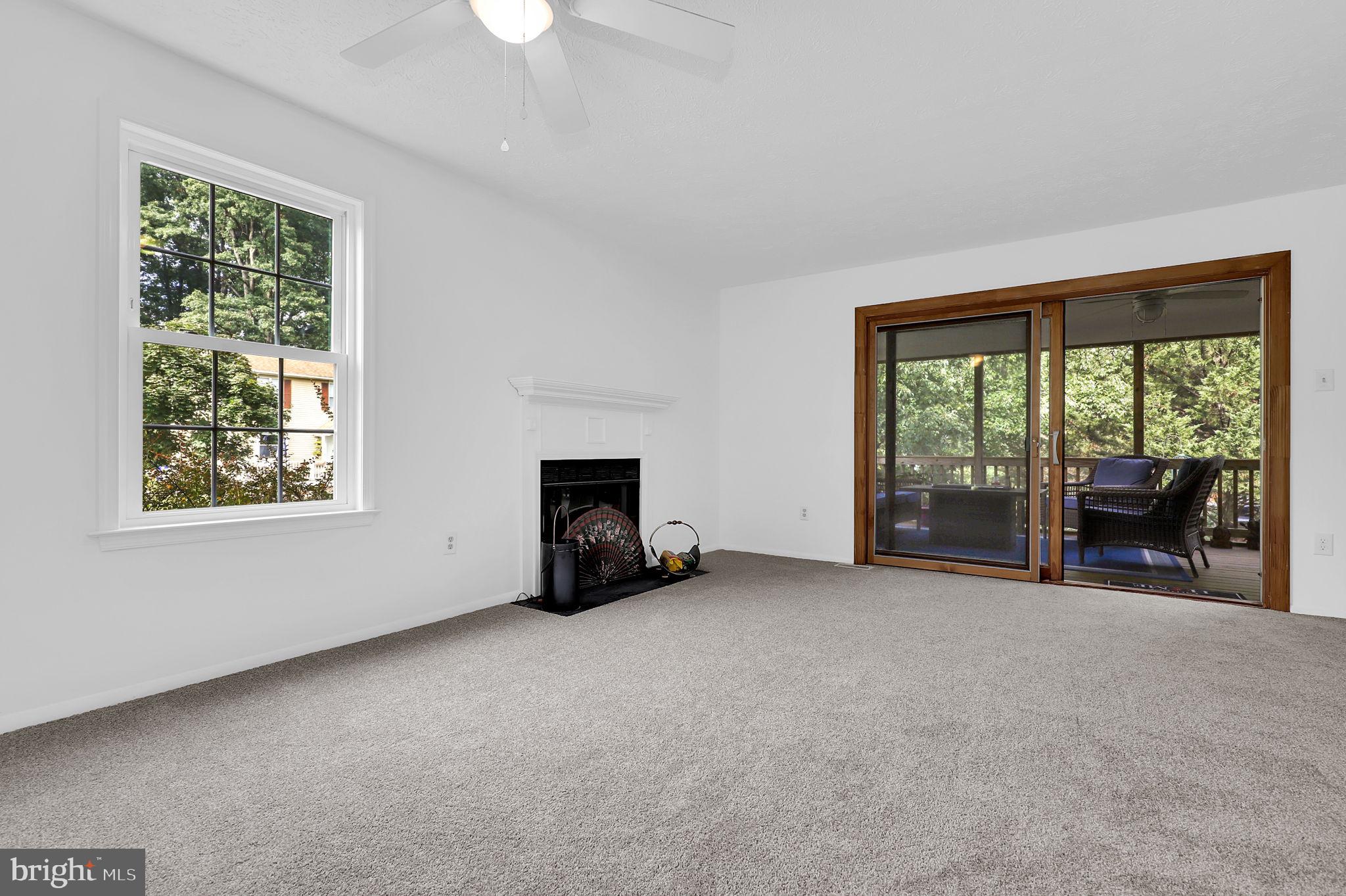 7922 Red Barn Way Elkridge, MD 21075 - Photo 7 of 31 an empty room with furniture and a large window
