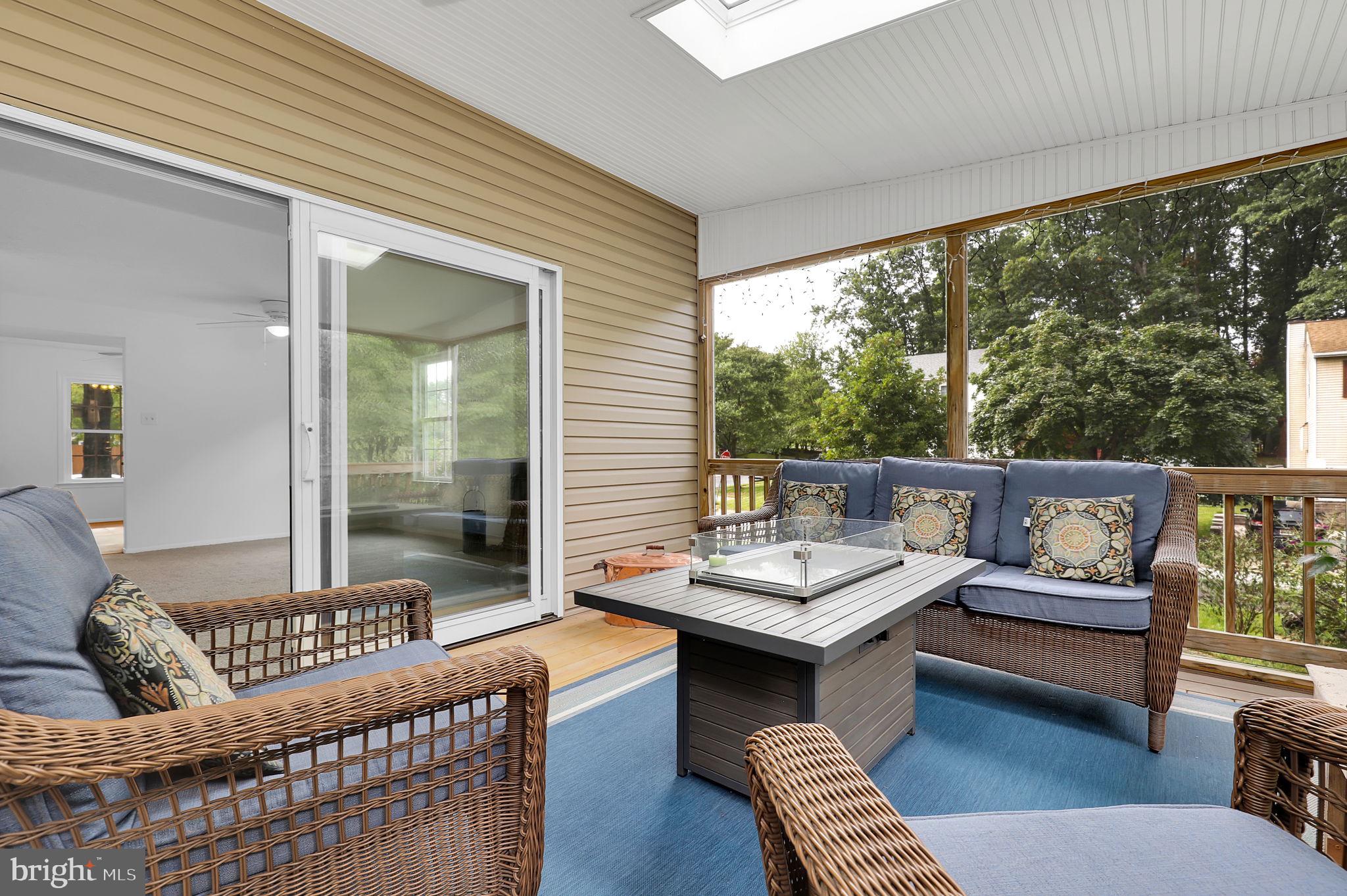 7922 Red Barn Way Elkridge, MD 21075 - Photo 8 of 31 a living room with furniture and a floor to ceiling window