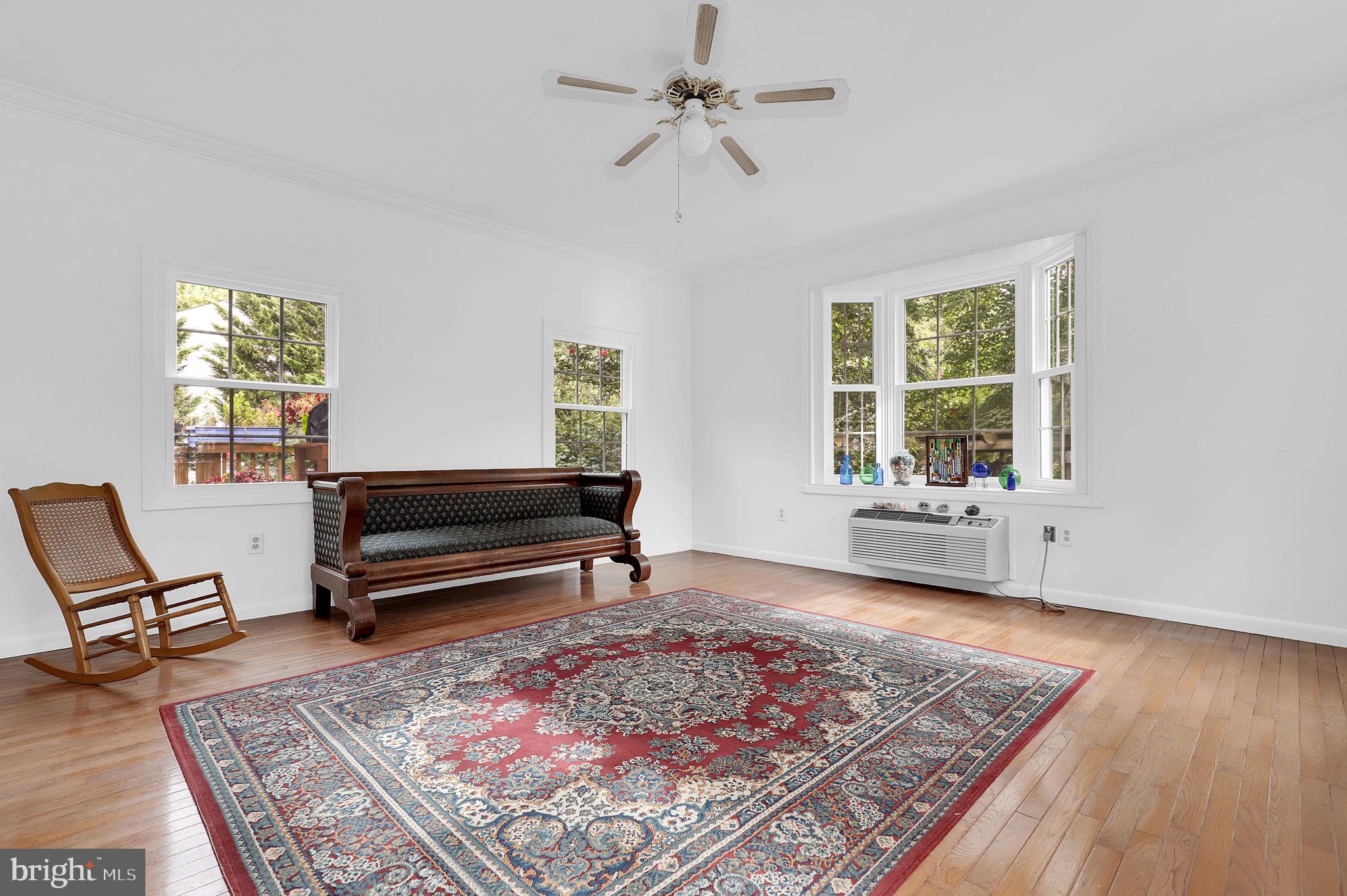 7922 Red Barn Way Elkridge, MD 21075 - Photo 10 of 31 a living room with furniture and a rug