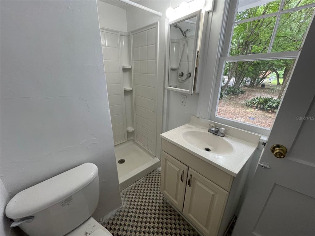 2635 West University Avenue Gainesville, FL 32607 - Photo 12 of 15 a bathroom with a sink toilet and shower