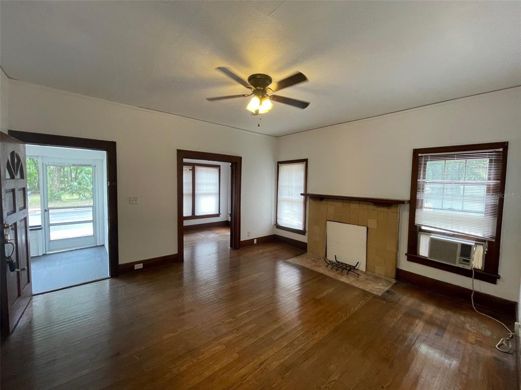 2635 West University Avenue Gainesville, FL 32607 - Photo 10 of 15 a view of an empty room with window and fireplace