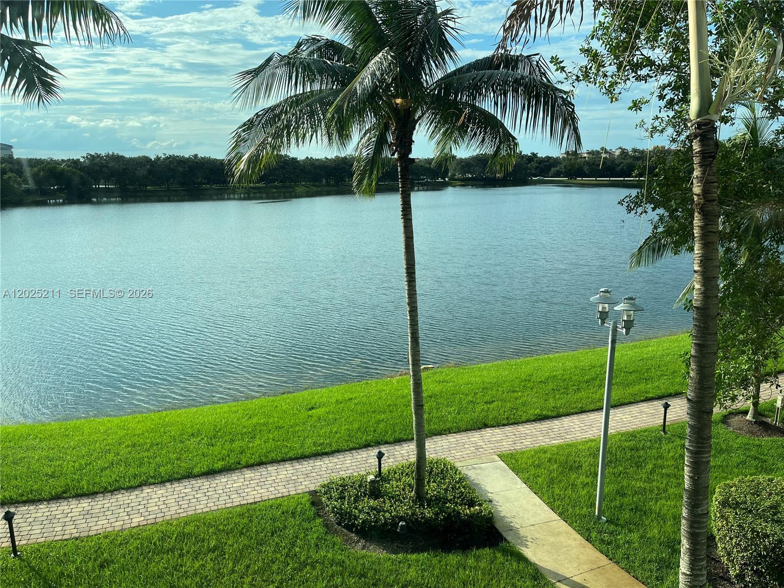 2681 North Flamingo Road, Unit 303S Sunrise, FL 33323 - Photo 14 of 18 a view of a lake and a yard