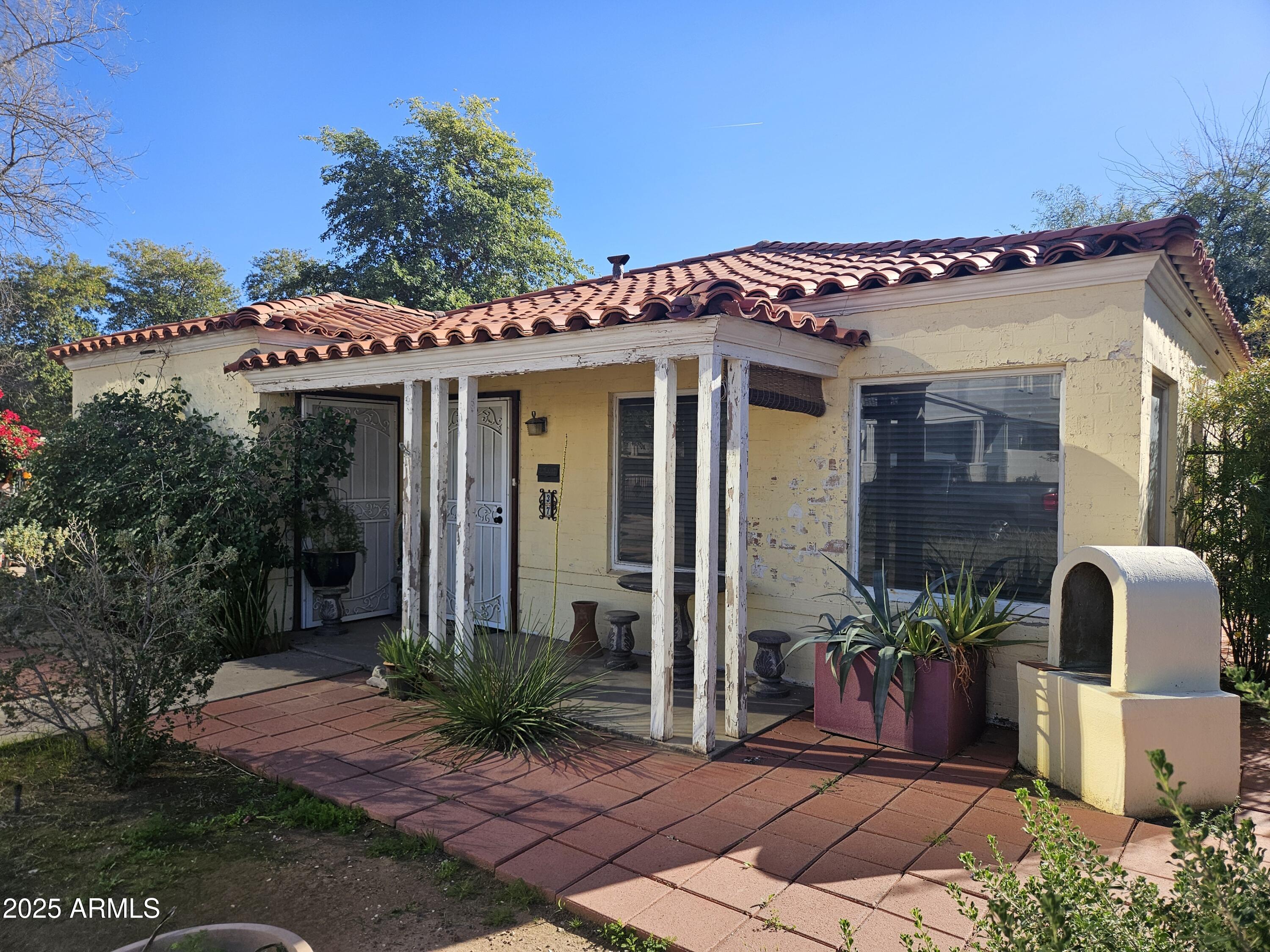 a front view of a house with garden
