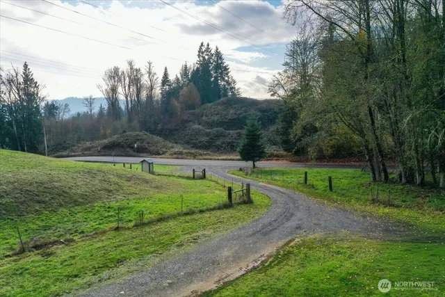 a view of a house with a backyard porch and sitting area