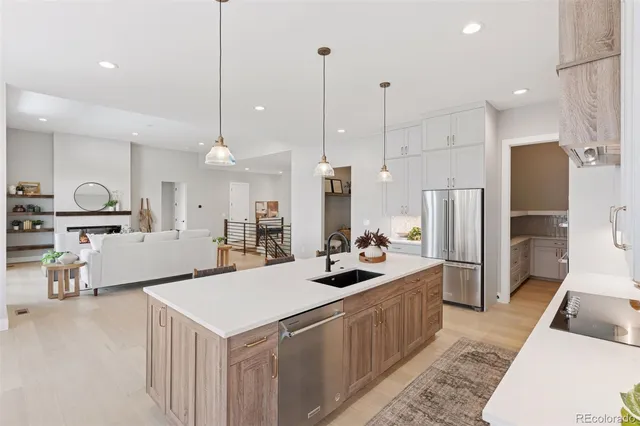 a kitchen with a sink and a refrigerator