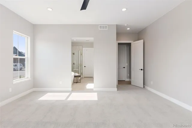 a spacious bathroom with a granite countertop tub sink a mirror a shower and vanity