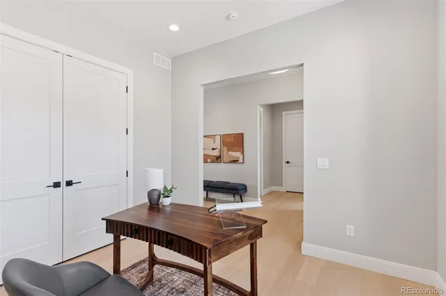 a view of a workspace with furniture