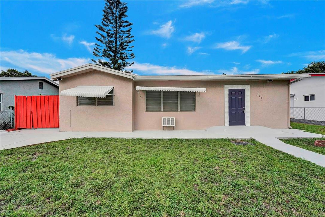a front view of a house with yard