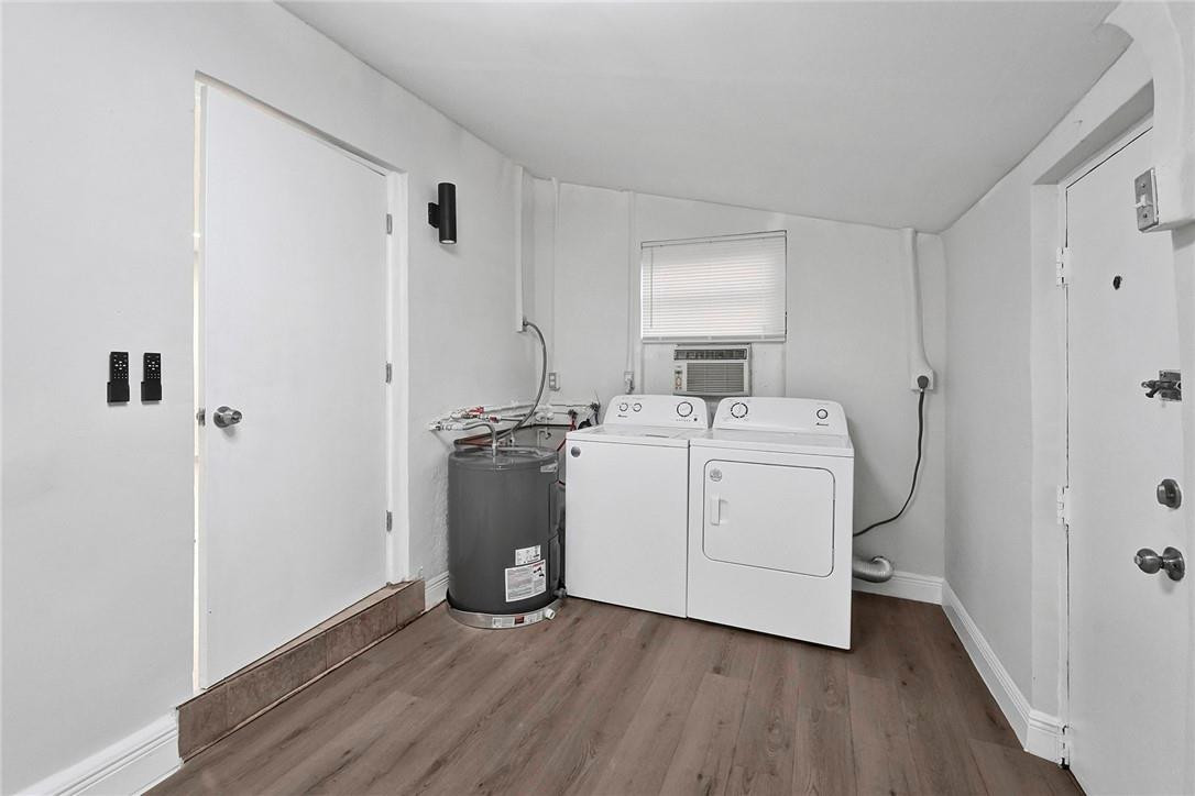 313 Southwest 9th Terrace Hallandale Beach, FL 33009 - Photo 17 of 20 a utility room with cabinets washer and dryer