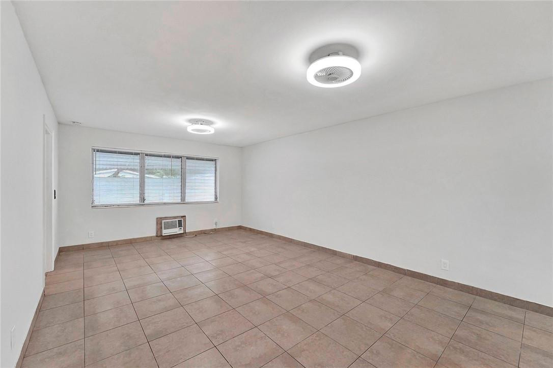 313 Southwest 9th Terrace Hallandale Beach, FL 33009 - Photo 9 of 20 an empty room with windows