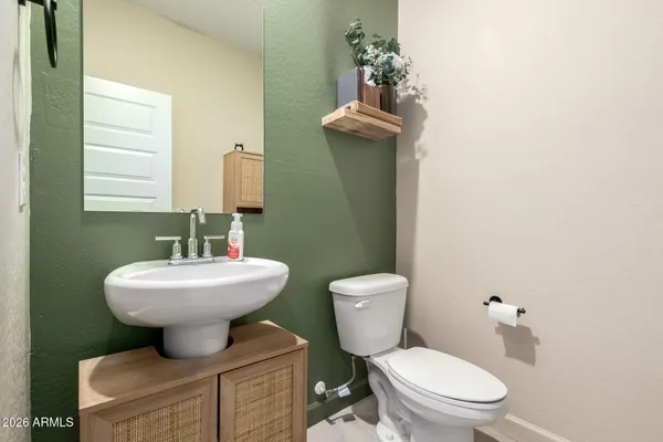 a spacious bedroom with a bed and a window