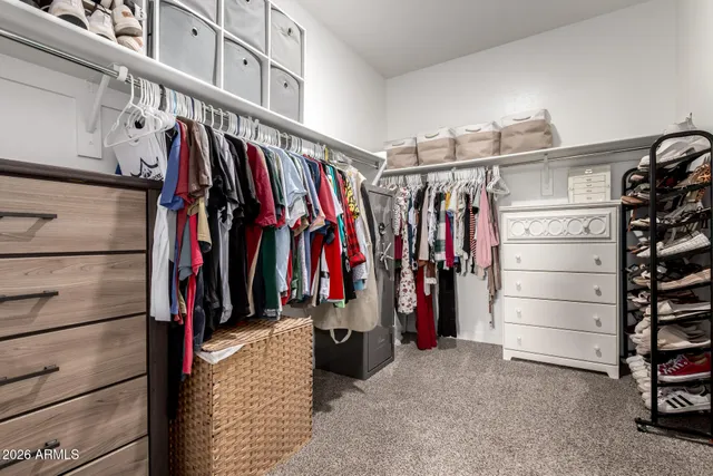 a living room with furniture a flat screen tv and a window