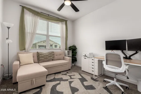 a bedroom with a bed and chair