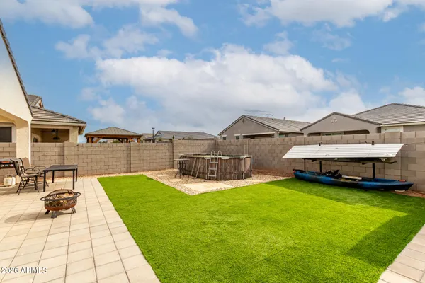 a gym room with lots of table furniture and a large window