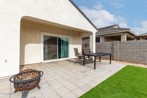 a view of a dining room with furniture and window