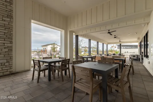 a view of a chairs and table in the patio