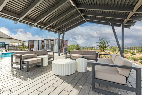 a bathroom with a granite countertop shower and a sink