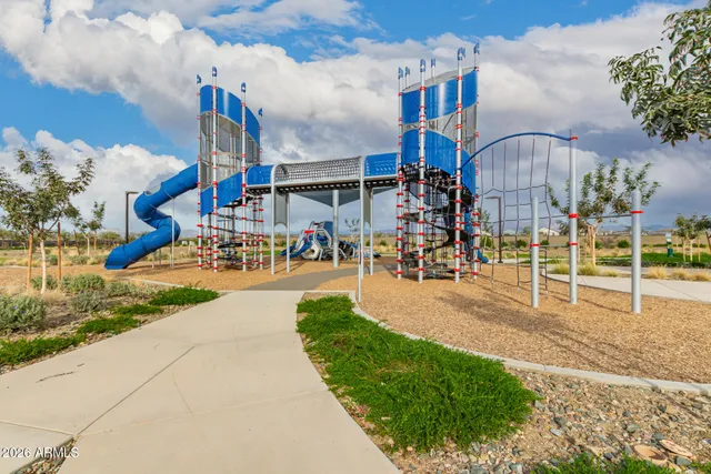 an aerial view of residential building with green space