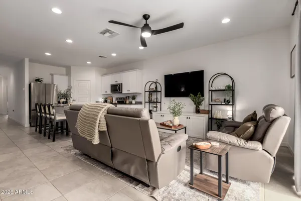 a view of a dining room with furniture and window