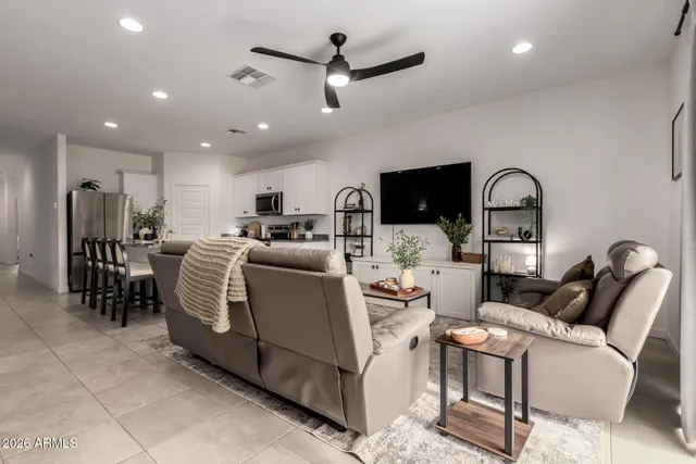 a view of a dining room with furniture and window