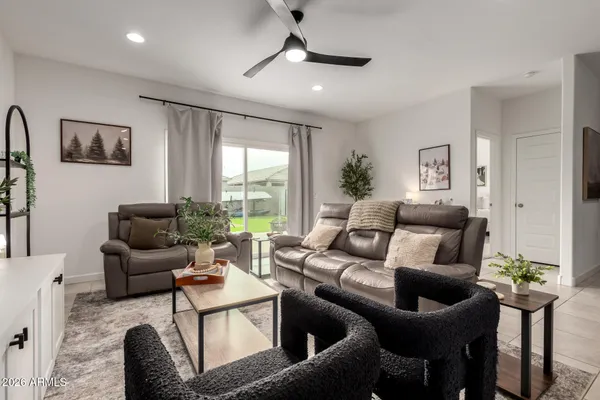 a living room with furniture and a large window