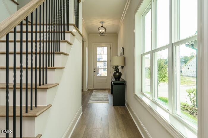 755 West Holly Springs Road Holly Springs, NC 27540 - Photo 10 of 45 a view of a hallway with wooden floor and staircase