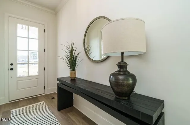 a view of a dining room with furniture window and wooden floor
