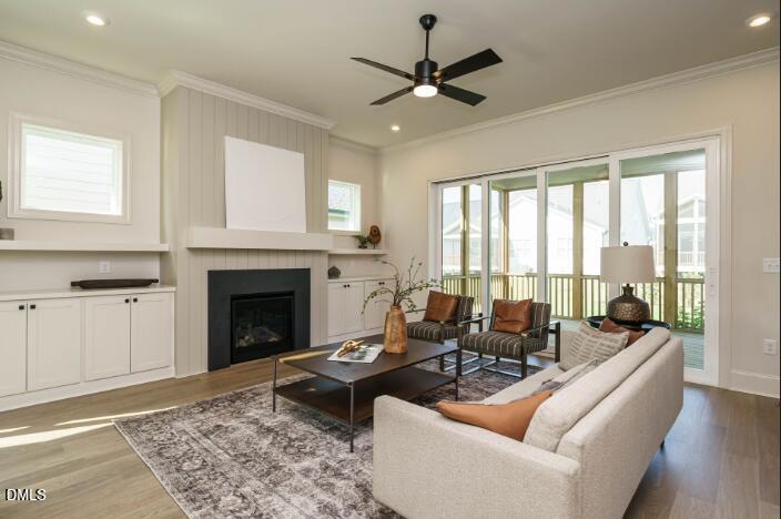755 West Holly Springs Road Holly Springs, NC 27540 - Photo 16 of 45 a living room with furniture and a fireplace