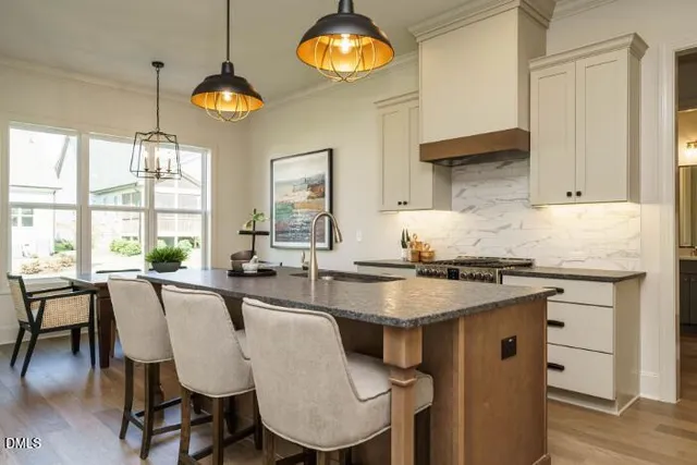 a view of a room with wooden floor and windows