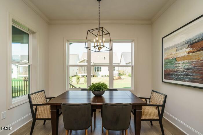 755 West Holly Springs Road Holly Springs, NC 27540 - Photo 22 of 45 a view of a dining room with furniture window and outside view