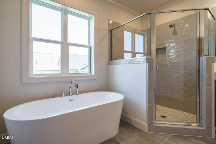 755 West Holly Springs Road Holly Springs, NC 27540 - Photo 26 of 45 a white bath tub sitting next to a shower