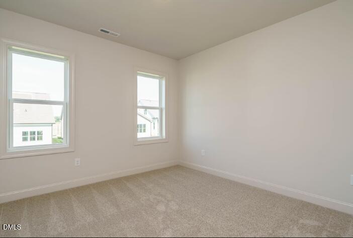 755 West Holly Springs Road Holly Springs, NC 27540 - Photo 36 of 45 an empty room with a window