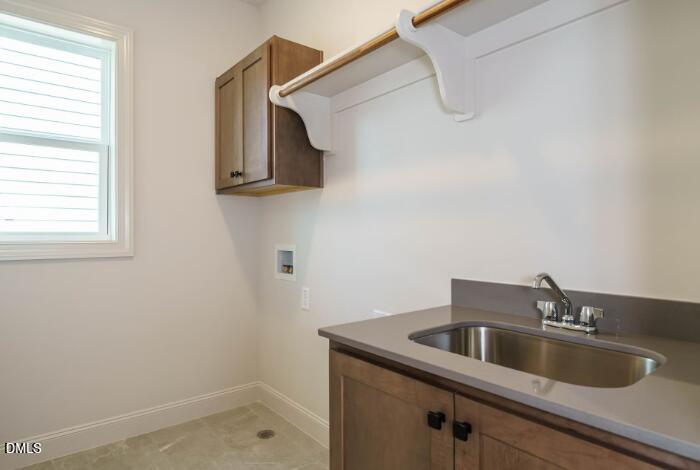 755 West Holly Springs Road Holly Springs, NC 27540 - Photo 39 of 45 a kitchen with a sink and cabinets