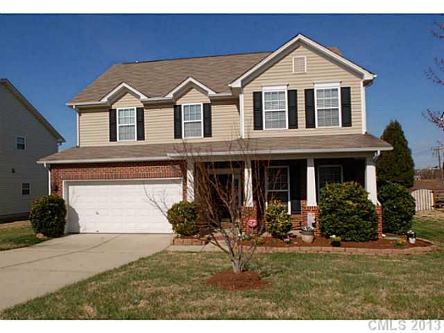 2005 Brook Valley Run Monroe, NC 28110 - Photo 1 of 15 a front view of a house with garden