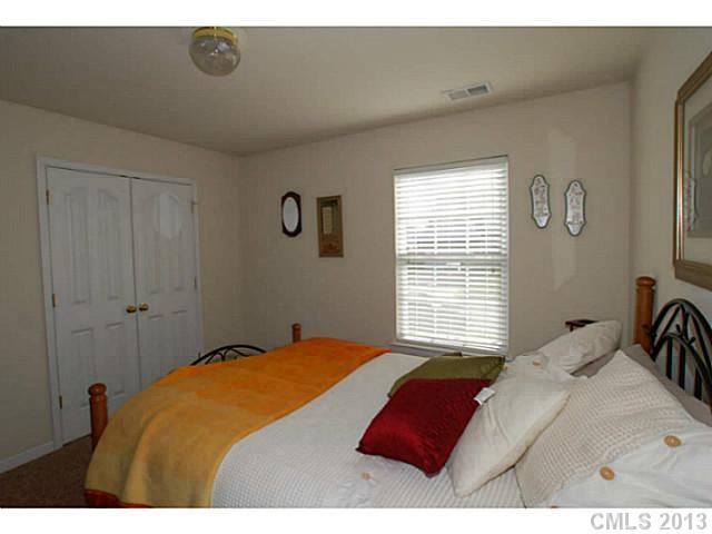 2005 Brook Valley Run Monroe, NC 28110 - Photo 12 of 15 a bedroom with a bed and a window