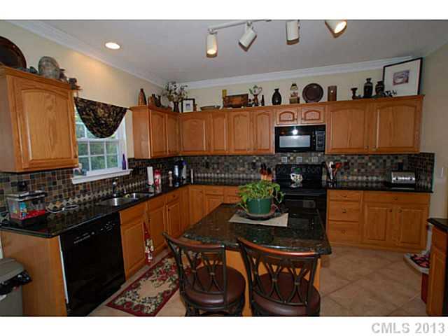 2005 Brook Valley Run Monroe, NC 28110 - Photo 5 of 15 a kitchen with a dining table and chairs