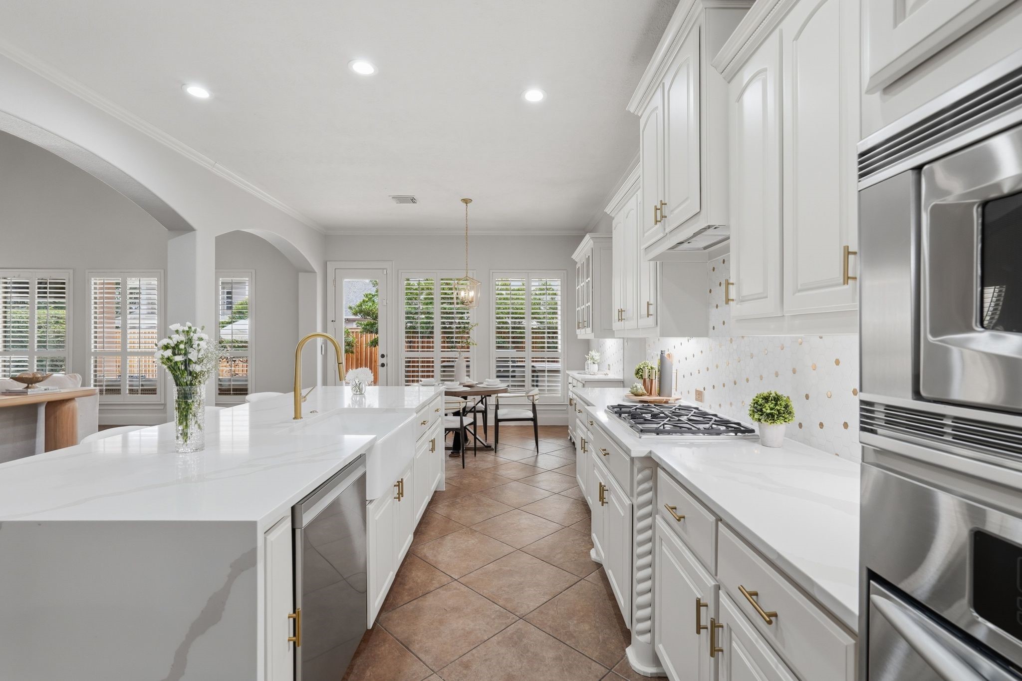 7603 Hogan Bridge Court Spring, TX 77389 - Photo 12 of 50 Sleek kitchen equipped with a gas cooktop and stainless-steel appliances.