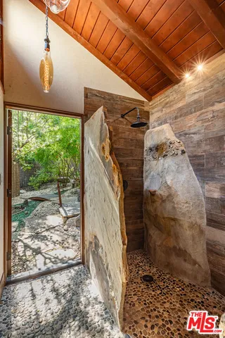 a view of a backyard with swimming pool