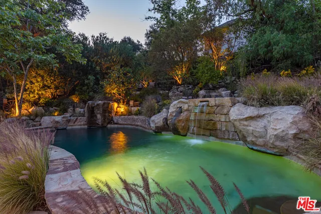a view of a big yard with swimming pool