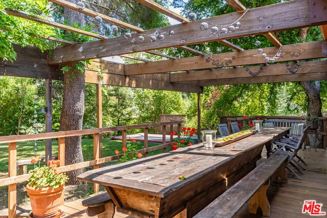 a backyard of a house with car parked
