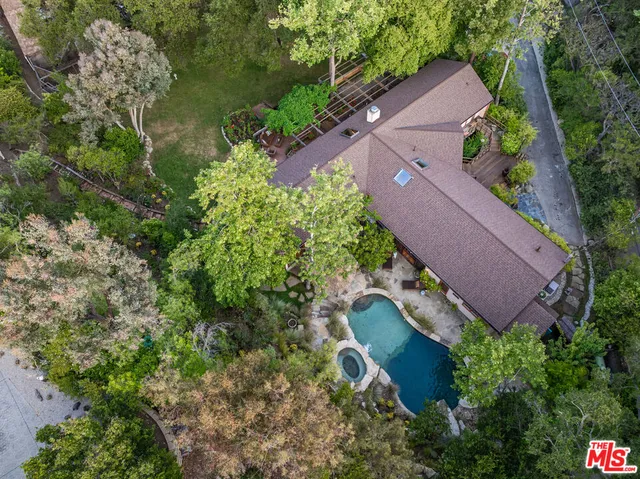 an aerial view of house with yard